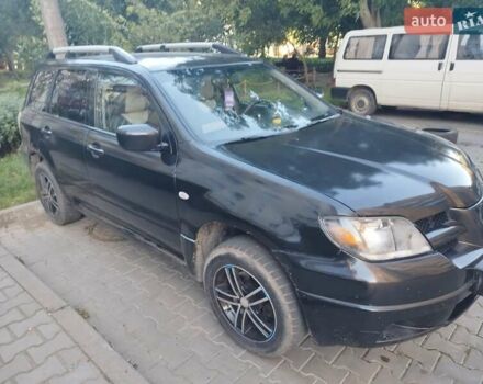 Черный Мицубиси Аутлендер, объемом двигателя 2 л и пробегом 245 тыс. км за 5500 $, фото 2 на Automoto.ua