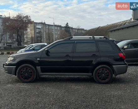 Черный Мицубиси Аутлендер, объемом двигателя 2 л и пробегом 240 тыс. км за 5500 $, фото 2 на Automoto.ua