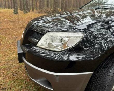 Черный Мицубиси Аутлендер, объемом двигателя 2 л и пробегом 232 тыс. км за 7000 $, фото 1 на Automoto.ua