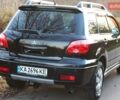Черный Мицубиси Аутлендер, объемом двигателя 2 л и пробегом 190 тыс. км за 6900 $, фото 13 на Automoto.ua