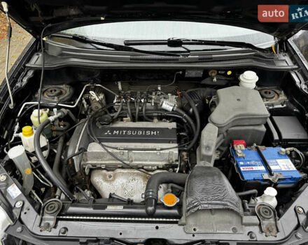Чорний Міцубісі Аутлендер, об'ємом двигуна 2 л та пробігом 254 тис. км за 7499 $, фото 20 на Automoto.ua