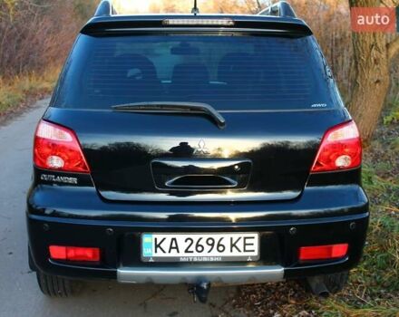 Черный Мицубиси Аутлендер, объемом двигателя 2 л и пробегом 190 тыс. км за 6900 $, фото 27 на Automoto.ua