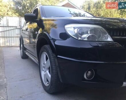 Чорний Міцубісі Аутлендер, об'ємом двигуна 2.38 л та пробігом 207 тис. км за 7000 $, фото 79 на Automoto.ua