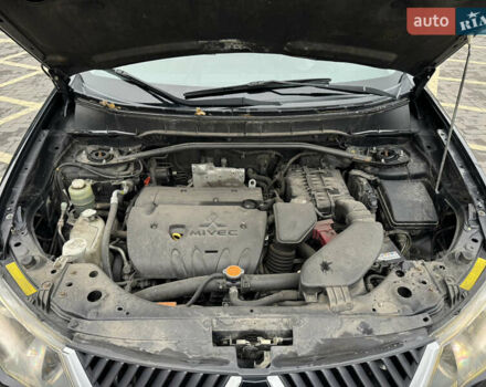 Черный Мицубиси Аутлендер, объемом двигателя 2.36 л и пробегом 120 тыс. км за 10100 $, фото 22 на Automoto.ua