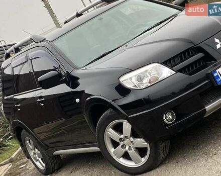 Черный Мицубиси Аутлендер, объемом двигателя 2.4 л и пробегом 178 тыс. км за 6900 $, фото 3 на Automoto.ua
