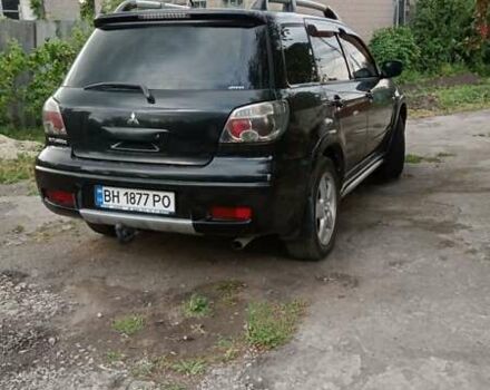 Черный Мицубиси Аутлендер, объемом двигателя 2 л и пробегом 240 тыс. км за 6500 $, фото 6 на Automoto.ua