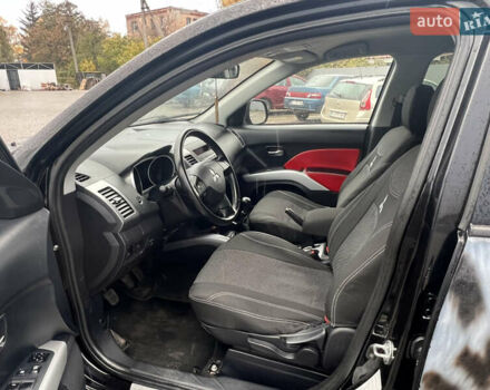 Черный Мицубиси Аутлендер, объемом двигателя 2.4 л и пробегом 230 тыс. км за 6650 $, фото 28 на Automoto.ua