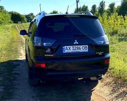 Черный Мицубиси Аутлендер, объемом двигателя 2.4 л и пробегом 217 тыс. км за 7300 $, фото 3 на Automoto.ua