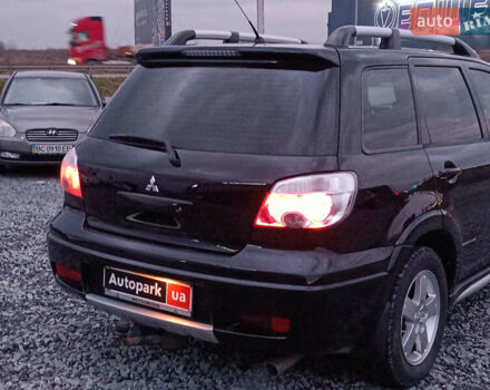 Чорний Міцубісі Аутлендер, об'ємом двигуна 2 л та пробігом 271 тис. км за 6940 $, фото 7 на Automoto.ua