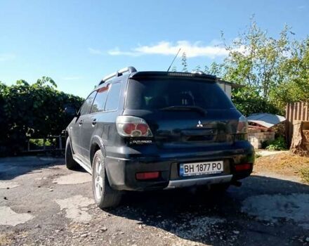 Черный Мицубиси Аутлендер, объемом двигателя 2 л и пробегом 240 тыс. км за 6500 $, фото 2 на Automoto.ua