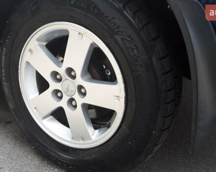 Чорний Міцубісі Аутлендер, об'ємом двигуна 2.36 л та пробігом 277 тис. км за 8500 $, фото 8 на Automoto.ua