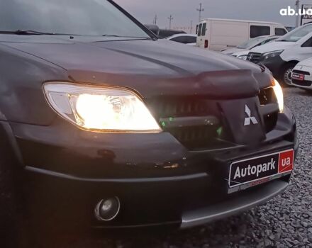 Черный Мицубиси Аутлендер, объемом двигателя 2 л и пробегом 271 тыс. км за 6940 $, фото 13 на Automoto.ua