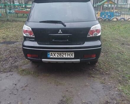 Черный Мицубиси Аутлендер, объемом двигателя 2.4 л и пробегом 270 тыс. км за 6700 $, фото 2 на Automoto.ua