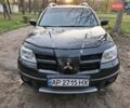 Чорний Міцубісі Аутлендер, об'ємом двигуна 2.38 л та пробігом 245 тис. км за 6800 $, фото 1 на Automoto.ua