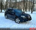 Черный Мицубиси Аутлендер, объемом двигателя 2.4 л и пробегом 145 тыс. км за 6850 $, фото 1 на Automoto.ua