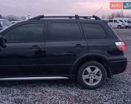 Чорний Міцубісі Аутлендер, об'ємом двигуна 2 л та пробігом 271 тис. км за 6940 $, фото 5 на Automoto.ua