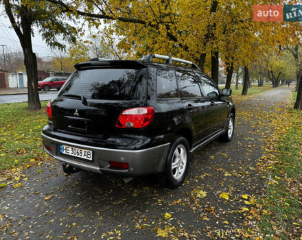 Чорний Міцубісі Аутлендер, об'ємом двигуна 2 л та пробігом 254 тис. км за 7499 $, фото 8 на Automoto.ua