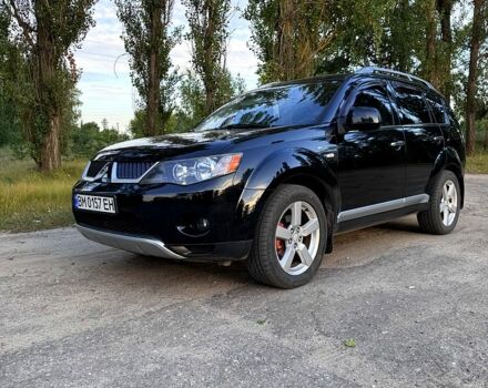 Черный Мицубиси Аутлендер, объемом двигателя 2.4 л и пробегом 208 тыс. км за 10200 $, фото 1 на Automoto.ua