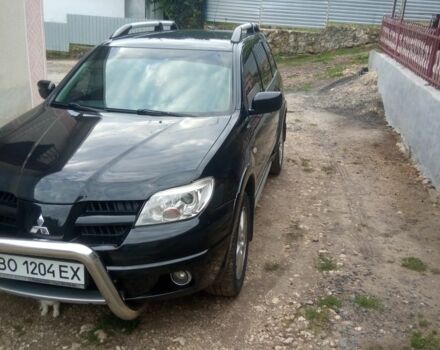 Чорний Міцубісі Аутлендер, об'ємом двигуна 2 л та пробігом 208 тис. км за 6700 $, фото 10 на Automoto.ua