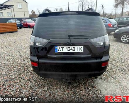 Черный Мицубиси Аутлендер, объемом двигателя 2.4 л и пробегом 200 тыс. км за 9999 $, фото 4 на Automoto.ua