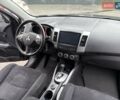 Черный Мицубиси Аутлендер, объемом двигателя 2.4 л и пробегом 185 тыс. км за 7900 $, фото 1 на Automoto.ua