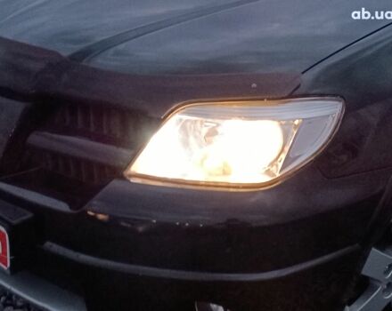 Черный Мицубиси Аутлендер, объемом двигателя 2 л и пробегом 271 тыс. км за 6940 $, фото 2 на Automoto.ua