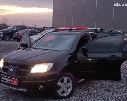 Черный Мицубиси Аутлендер, объемом двигателя 2 л и пробегом 271 тыс. км за 6940 $, фото 23 на Automoto.ua