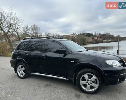 Чорний Міцубісі Аутлендер, об'ємом двигуна 2 л та пробігом 118 тис. км за 8100 $, фото 6 на Automoto.ua