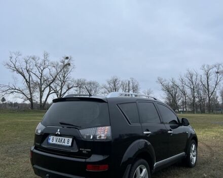 Черный Мицубиси Аутлендер, объемом двигателя 2.4 л и пробегом 230 тыс. км за 8800 $, фото 2 на Automoto.ua