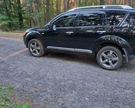 Черный Мицубиси Аутлендер, объемом двигателя 2.36 л и пробегом 245 тыс. км за 9200 $, фото 2 на Automoto.ua