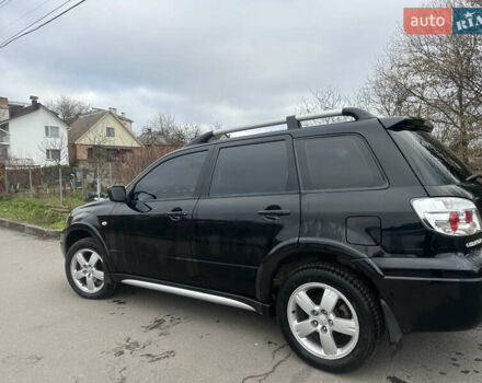Чорний Міцубісі Аутлендер, об'ємом двигуна 2 л та пробігом 118 тис. км за 8100 $, фото 14 на Automoto.ua