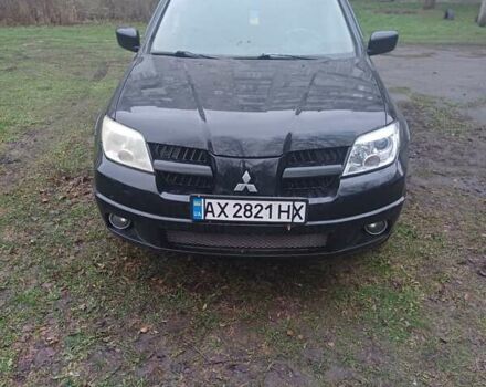 Черный Мицубиси Аутлендер, объемом двигателя 2.4 л и пробегом 270 тыс. км за 6700 $, фото 4 на Automoto.ua