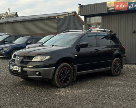 Черный Мицубиси Аутлендер, объемом двигателя 2 л и пробегом 240 тыс. км за 5500 $, фото 1 на Automoto.ua