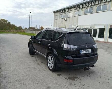 Черный Мицубиси Аутлендер, объемом двигателя 2.2 л и пробегом 200 тыс. км за 9500 $, фото 1 на Automoto.ua