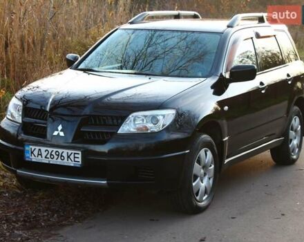 Черный Мицубиси Аутлендер, объемом двигателя 2 л и пробегом 190 тыс. км за 6900 $, фото 1 на Automoto.ua