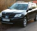 Черный Мицубиси Аутлендер, объемом двигателя 2 л и пробегом 190 тыс. км за 6900 $, фото 1 на Automoto.ua