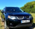 Черный Мицубиси Аутлендер, объемом двигателя 2.4 л и пробегом 217 тыс. км за 7300 $, фото 2 на Automoto.ua