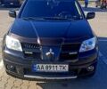 Чорний Міцубісі Аутлендер, об'ємом двигуна 2 л та пробігом 364 тис. км за 5900 $, фото 1 на Automoto.ua