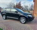 Черный Мицубиси Аутлендер, объемом двигателя 2 л и пробегом 249 тыс. км за 8750 $, фото 1 на Automoto.ua