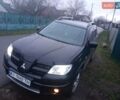 Чорний Міцубісі Аутлендер, об'ємом двигуна 2 л та пробігом 220 тис. км за 5599 $, фото 1 на Automoto.ua
