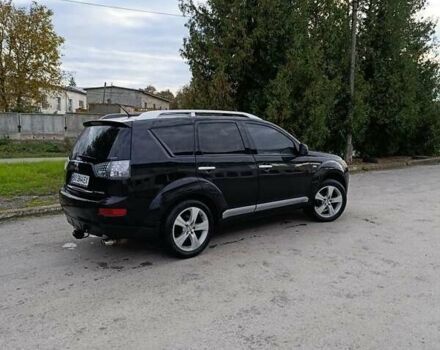 Черный Мицубиси Аутлендер, объемом двигателя 2.2 л и пробегом 200 тыс. км за 9500 $, фото 2 на Automoto.ua