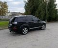 Черный Мицубиси Аутлендер, объемом двигателя 2.2 л и пробегом 200 тыс. км за 9500 $, фото 2 на Automoto.ua