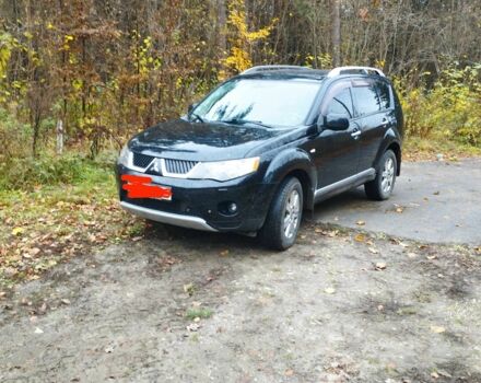 Черный Мицубиси Аутлендер, объемом двигателя 2 л и пробегом 242 тыс. км за 5500 $, фото 1 на Automoto.ua