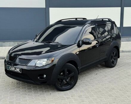 Черный Мицубиси Аутлендер, объемом двигателя 2.4 л и пробегом 199 тыс. км за 6470 $, фото 1 на Automoto.ua