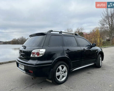 Чорний Міцубісі Аутлендер, об'ємом двигуна 2 л та пробігом 118 тис. км за 8100 $, фото 10 на Automoto.ua