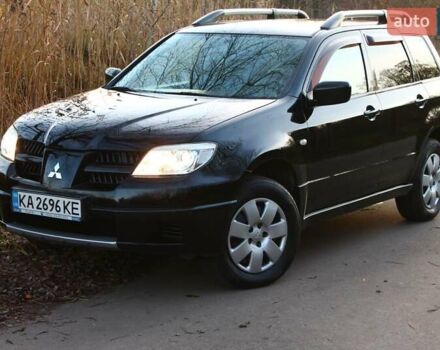 Черный Мицубиси Аутлендер, объемом двигателя 2 л и пробегом 190 тыс. км за 6900 $, фото 14 на Automoto.ua