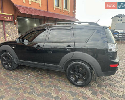 Черный Мицубиси Аутлендер, объемом двигателя 2.4 л и пробегом 199 тыс. км за 8777 $, фото 2 на Automoto.ua
