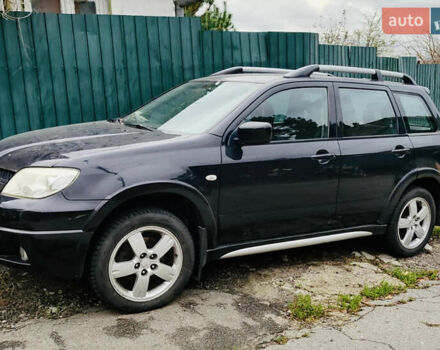 Чорний Міцубісі Аутлендер, об'ємом двигуна 2.4 л та пробігом 200 тис. км за 6790 $, фото 1 на Automoto.ua