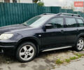 Чорний Міцубісі Аутлендер, об'ємом двигуна 2.4 л та пробігом 200 тис. км за 6790 $, фото 1 на Automoto.ua