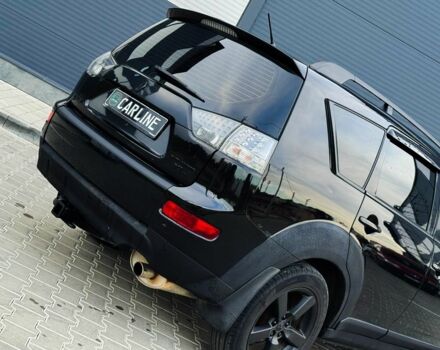 Черный Мицубиси Аутлендер, объемом двигателя 2.4 л и пробегом 199 тыс. км за 6470 $, фото 6 на Automoto.ua